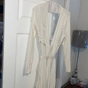 Size large whitish cream jumper. worn for less than 4 hours.